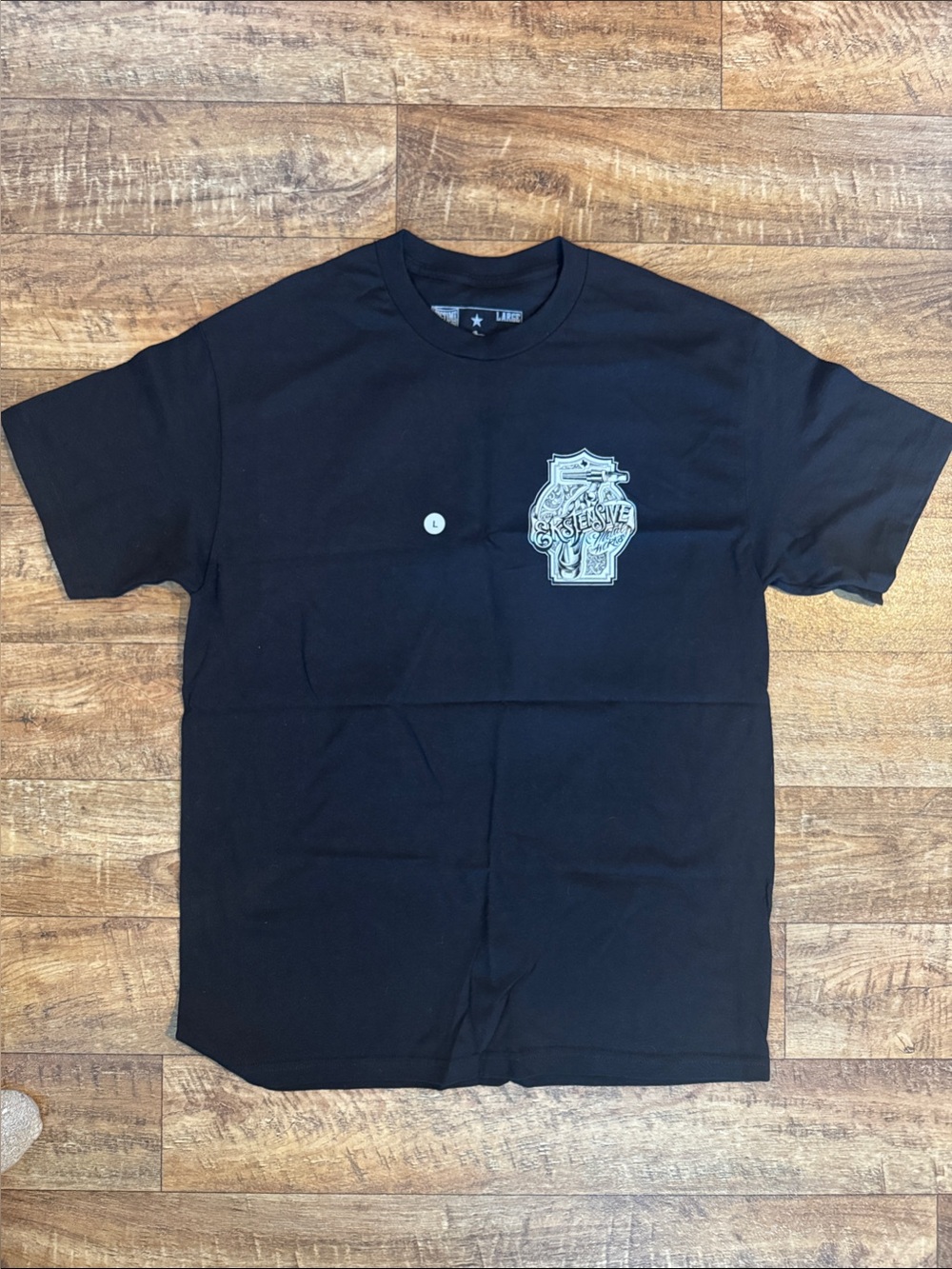 Black Short-Sleeve Graphic Tee with Crest Detail